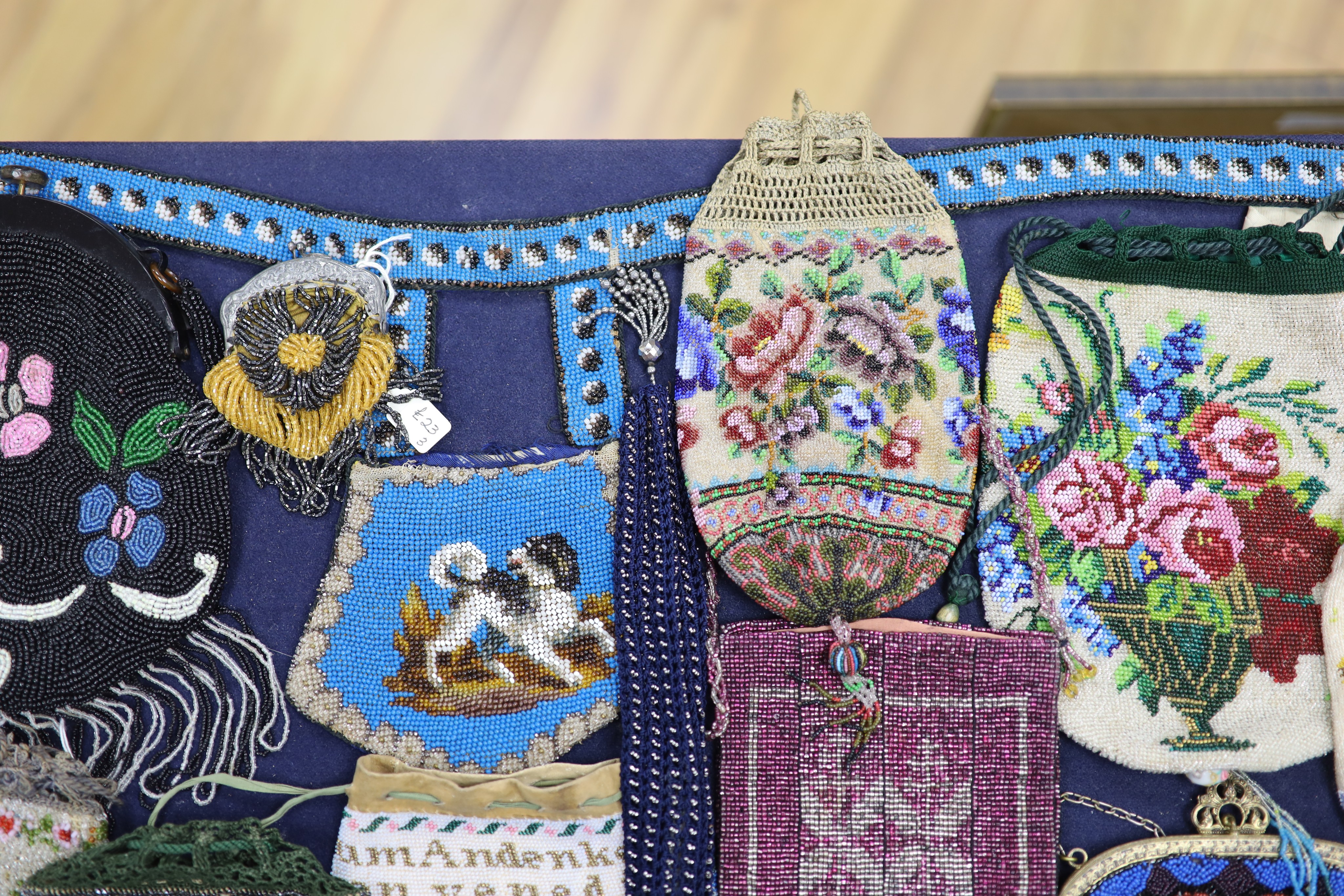 A collection of approximately fifty Victorian and later beadwork, white metal and fabric purses etc.